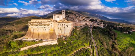 Impressive medieval Assisi town in Umbria. Italy.  aerial drone panoramic view. italian travel and best destinations