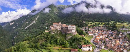 Photo for Medieval castles of northern Italy.  Castle Stenico and village. Trentino region, province of Trento. Aerial drone high angle view - Royalty Free Image