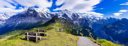 Photo for Swiss nature scenery. Scenic snowy Alps mountains Beauty in nature. Switzerland landscape. View of Mannlichen mountain and famous hiking route "Royal road" - Royalty Free Image