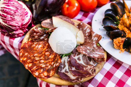 Photo for Travel in Italy, Part of Italian culture - healthy mediterranean italian food. Rome street restaurants with variety of typical alumi and mozarella - Royalty Free Image
