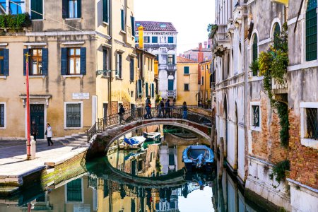 Photo for Romantic Venetian streets and canals. Bridges of Venice town, Italy - Royalty Free Image