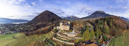 Most beautiful medieval castles of France - fairytale Menthon located near lake Annecy. aerial panoramic vie