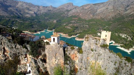 Photo for Landmarks of Spain. medieval village Guadalest, aerial drone view scenery with castle on the rocks and turquoise lake. Alicante provinc - Royalty Free Image