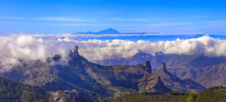 Photo for Grand Canary island, panoramic view of Roque nublo over clouds and view of Theide volcano in Tenerife. Canaries islands of Spain - Royalty Free Image