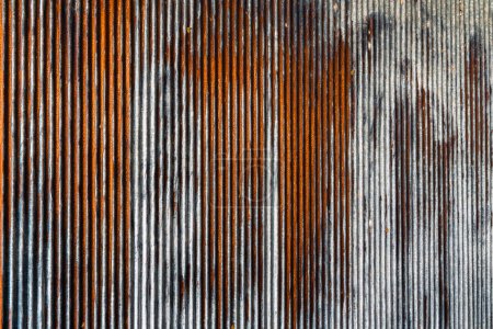Photo for Artistic of old and rusty zinc sheet wall. Vintage style metal sheet roof texture. Pattern of old metal sheet. Rusting metal or siding. Corrosion of galvanized. Background and texture in retro concept - Royalty Free Image