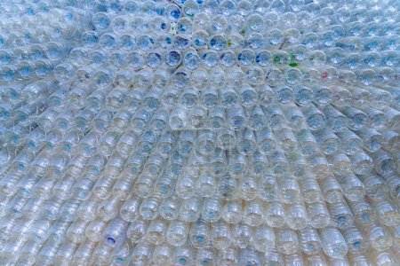 Photo for Beautiful wall made of recycled transparent plastic bottles - Royalty Free Image