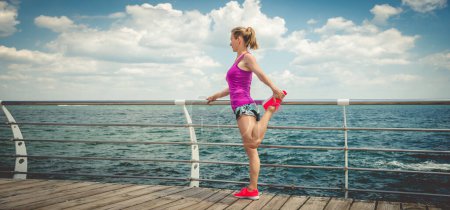 Photo for Young beautiful sportive girl preparing to run over seaside. - Royalty Free Image