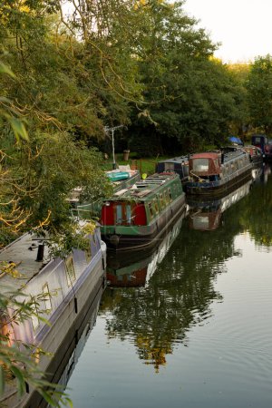 Photo for Sawbridgeworth, Hertfordshire England  October 10th 2022: Canal boats moored up at the Sawbridgeworth moorings for the start of winter. - Royalty Free Image