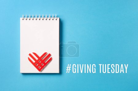 Photo for Giving Tuesday, global day of charitable giving after Black Friday shopping day. Charity, give help, donations support concept. Red paper heart and shopping bag on blue background. Top view, copy space, flat lay. - Royalty Free Image
