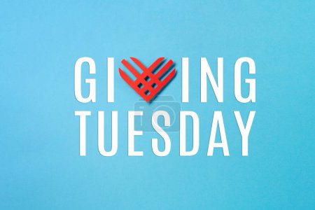 Photo for Giving Tuesday, global day of charitable giving after Black Friday shopping day. Charity, give help, donations support concept. Red paper heart on blue paper background. Top view, copy space, flat lay. - Royalty Free Image