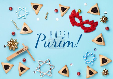 Photo for Purim celebration jewish carnival holiday concept. Tasty hamantaschen cookies, red carnival mask, noisemaker, sweet candies and party decor on blue background. Top view, flat lay, copy space. - Royalty Free Image