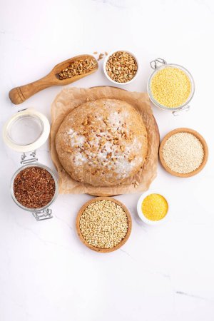 Photo for Ancient grain food. Bread Gluten free, Healthy eating, dieting, balanced food concept. Cereals gluten-free, millet, quinoa, polenta, buckwheat, flax seeds, sunflower seeds on white background. - Royalty Free Image