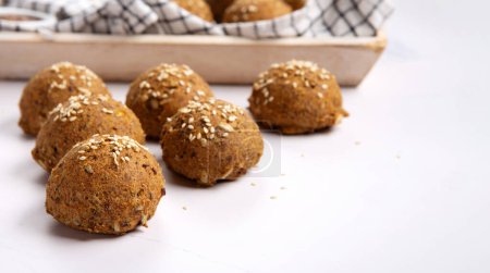 Photo for Gluten Free Homemade Bread Buns. Healthy eating, dieting, balanced food concept. Cereals gluten-free (millet, quinoa, buckwheat), psyllium husks,  flax seeds, sunflower seeds on marble background. - Royalty Free Image