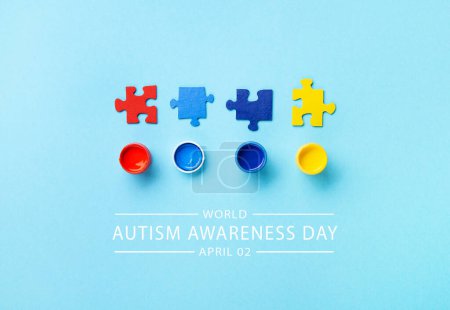 Photo for World Autism Awareness Day or month concept. Creative design for April 2. White puzzles, symbol of awareness for autism spectrum disorder and colorful paints on blue background. Top view, copy space. - Royalty Free Image