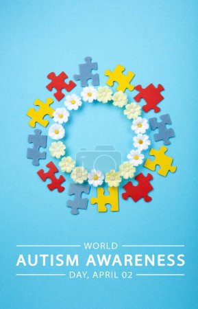Photo for World Autism Awareness Day or month concept. Creative design for April 2. Color puzzle, symbol of awareness for autism spectrum disorder and daisy flowers on blue background. Top view, copy space. - Royalty Free Image