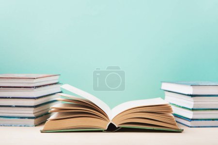 Photo for World book and Copyright day, Education concept. Stack of books on blue mint background. Festive card for books holiday, copy space. - Royalty Free Image