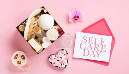 Photo for Happy Self Care Day. Natural eco friendly beauty skin care products concept. Zero waste bathroom and Organic spa accessories on pink background. Handmade soap bars. Concept of me time - Royalty Free Image