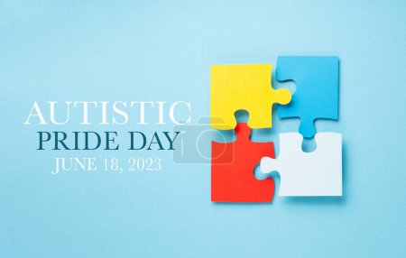 Photo for Autistic Pride Day concept. Creative design for June 18. Color puzzle, symbol of awareness for autism spectrum disorder on blue background. Top view, copy space. - Royalty Free Image