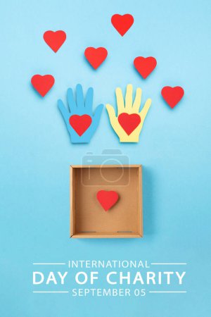 Téléchargez les photos : International Day of Charity, 5 September. Tolerance, kindness, cooperative, friendship, charity, humanitarian aid day concept. Colorful hands on blue background, copy space, top view. - en image libre de droit