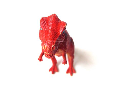Foto de Primer plano del juguete de dinosaurio Tyrannosaurus Rex. Juguete para niños aislado sobre fondo blanco. - Imagen libre de derechos