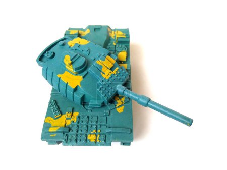 Close up of green plastic toy tank isolated on white background.