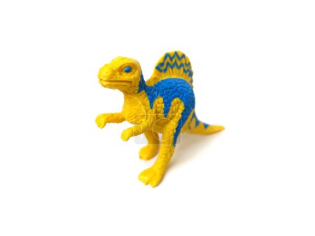 Foto de Primer plano del juguete de goma de dinosaurio Ouranosaurus. Juguete para niños aislado sobre fondo blanco. - Imagen libre de derechos