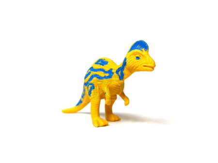 Close up of rubber Corythosaurus dinosaur rubber toy. Kids toy isolated on white background.