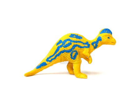 Close up of rubber Corythosaurus dinosaur rubber toy. Kids toy isolated on white background.