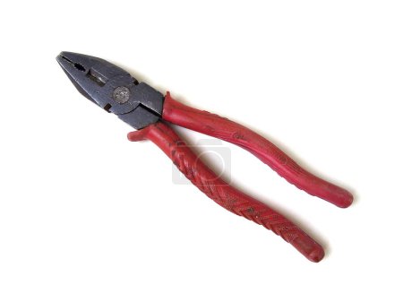 Photo for Old red handle rusty pliers isolated on white background. Close up of hand tool. - Royalty Free Image