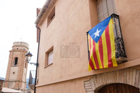 Estelada Vermella, Catalan nationalist flag, placed on balconies of a town in the interior of Tarragona.