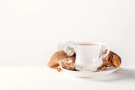 Photo for White porcelain vintage cup with mushroom coffee on white background. New Superfood Trend, selective focus and copy space - Royalty Free Image