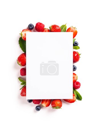 Photo for Overhead shot of paper blank, strawberry, raspberry and blueberry on white background, top view, flat lay. Healthy food concept with copy space - Royalty Free Image