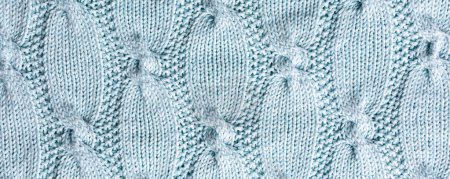 Photo for Banner with abstract turquoise cable knitted pattern background texture. Top view of knitting clothes en ball yarn - Royalty Free Image