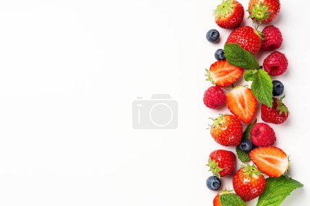 Photo for Assorted berries, strawberry, raspberry and blueberry on white background, top view, flat lay. Healthy food concept with copy space - Royalty Free Image