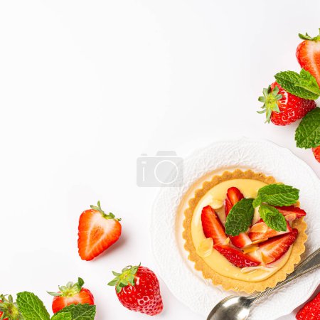 Photo for Flat lay with strawberry mini cake tartlet with vanilla custard and mint leaves over white background. Concept of homemade healthy sweet pastries. Copy space, top view, above - Royalty Free Image