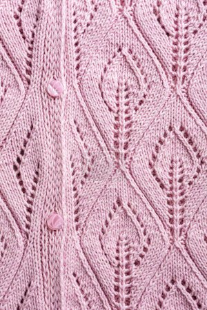 Photo for Handmade pink knitting wool texture background with knitted leaf shapes. Part of cardigan with buttons. Top view of knitting clothes - Royalty Free Image