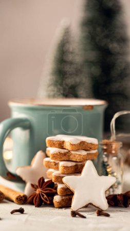 Photo for Stack of Zimtsterne, homemade german christmas cookies. Close up of gingerbread cookies. Winter holidays background banner with copy space. Toned photo. Story template and phone background format - Royalty Free Image