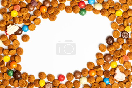 Photo for Concept for greeting card with traditional Dutch cookies kruidnoten for Saint Nicholas winter holiday called Sinterklaas in Netherlands, Belgium, Luxembourg. Top view background with copy space - Royalty Free Image