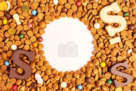 Photo for Background Dutch holiday Sinterklaas with copy space fot text. Kruidnoten cookies and traditional hollands sweets. Concept for children party Saint Nicolas day five december. Top view. - Royalty Free Image