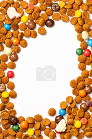 Photo for Frame for greeting card with traditional Dutch cookies kruidnoten for Saint Nicholas winter holiday called Sinterklaas in Netherlands, Belgium, Luxembourg. Top view background with copy space - Royalty Free Image
