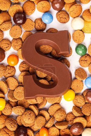 Photo for Dutch holiday Sinterklaas background with chocolate letter, kruidnoten cookies and traditional hollands sweets. - Royalty Free Image
