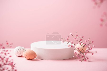 Photo for Abstract empty white podium with Easter quail eggs and spring flowers on pink background. Mock up stand for product presentation. Minimal concept. Advertising template - Royalty Free Image