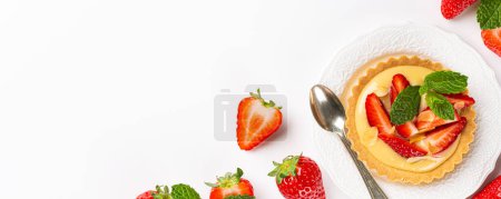 Photo for Banner with strawberry mini cake tartlet with vanilla custard and mint leaves over white background. Concept of homemade healthy sweet pastries. Copy space, top view, above - Royalty Free Image