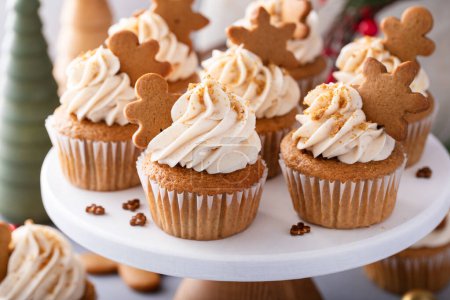 Gingerbread cupcakes with cream cheese frosting topped with gingerbread cookies, Christmas dessert idea