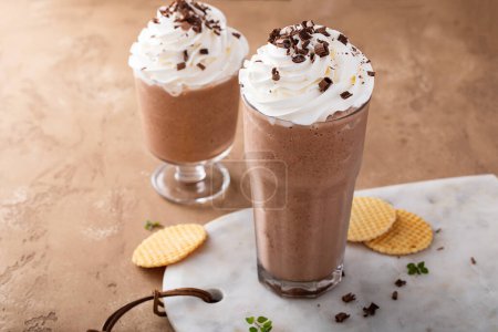 Photo for Mocha coffee frappe topped with whipped cream and chocolate curls - Royalty Free Image