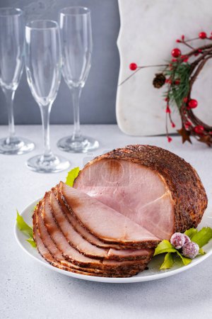 Photo for Christmas ham for celebration dinner, honey glazed baked spiral sliced ham boneless on a serving plate - Royalty Free Image