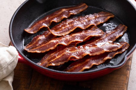 Turkey bacon cooked on a cast iron pan ready to eat
