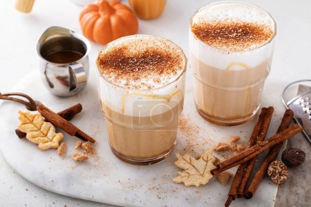 Photo for Pumpkin spice latte with milk foam and topped with cinnamon - Royalty Free Image