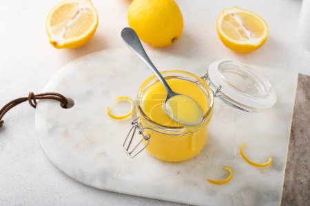 Freshly made lemon curd in a jar, homemade dessert or topping