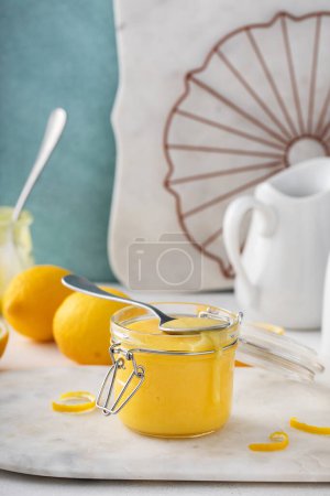 Freshly made lemon curd in a jar, homemade dessert or topping